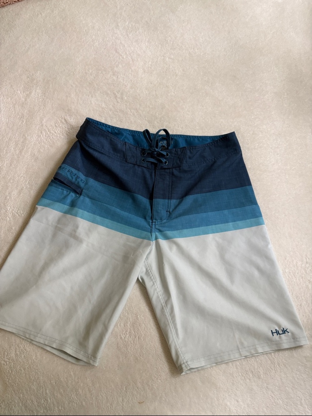 Huk Men's Navy to Light Blue Gradient Stripe Unlined Board Shorts